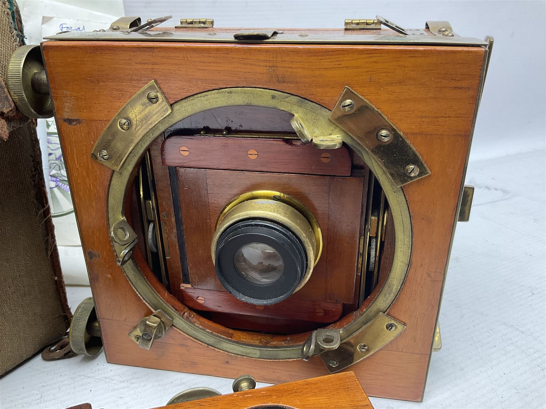 Sands Hunter & Co Ltd folding 1/4 plate camera in mahogany and lacquered brass, with two lenses and leather case