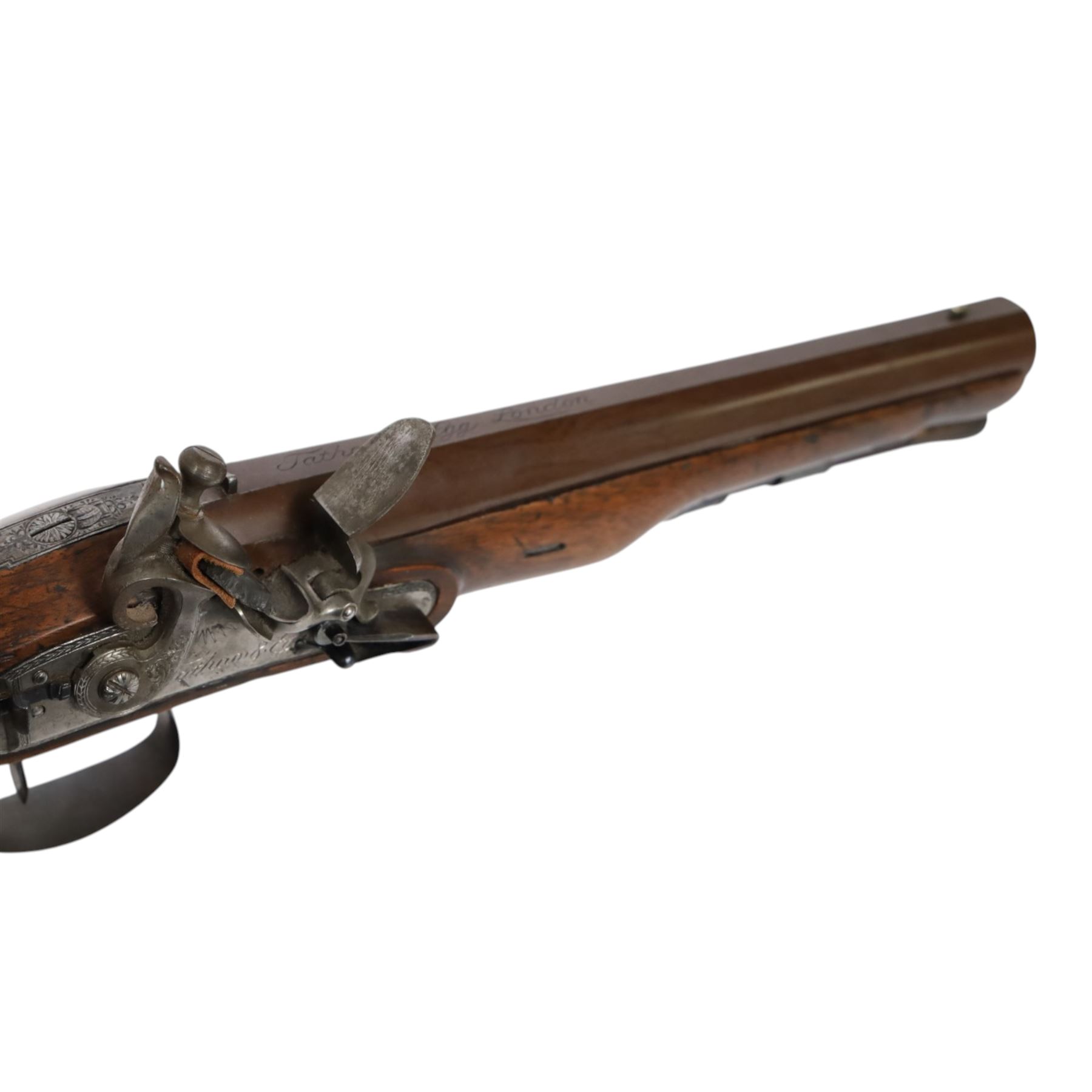 19th century British flintlock pistol by Tatham and Egg, with 21cms Damascus steel sighted barrel with original browning, marked along the top Tatham and Egg London, ramrod beneath, tang and trigger guard engraved with floral scrolls, figured walnut stock with chequered grip and steal butt plate, together with Dixon & Sons Sheffield, three way pistol powder flask, pistol overall L34cm