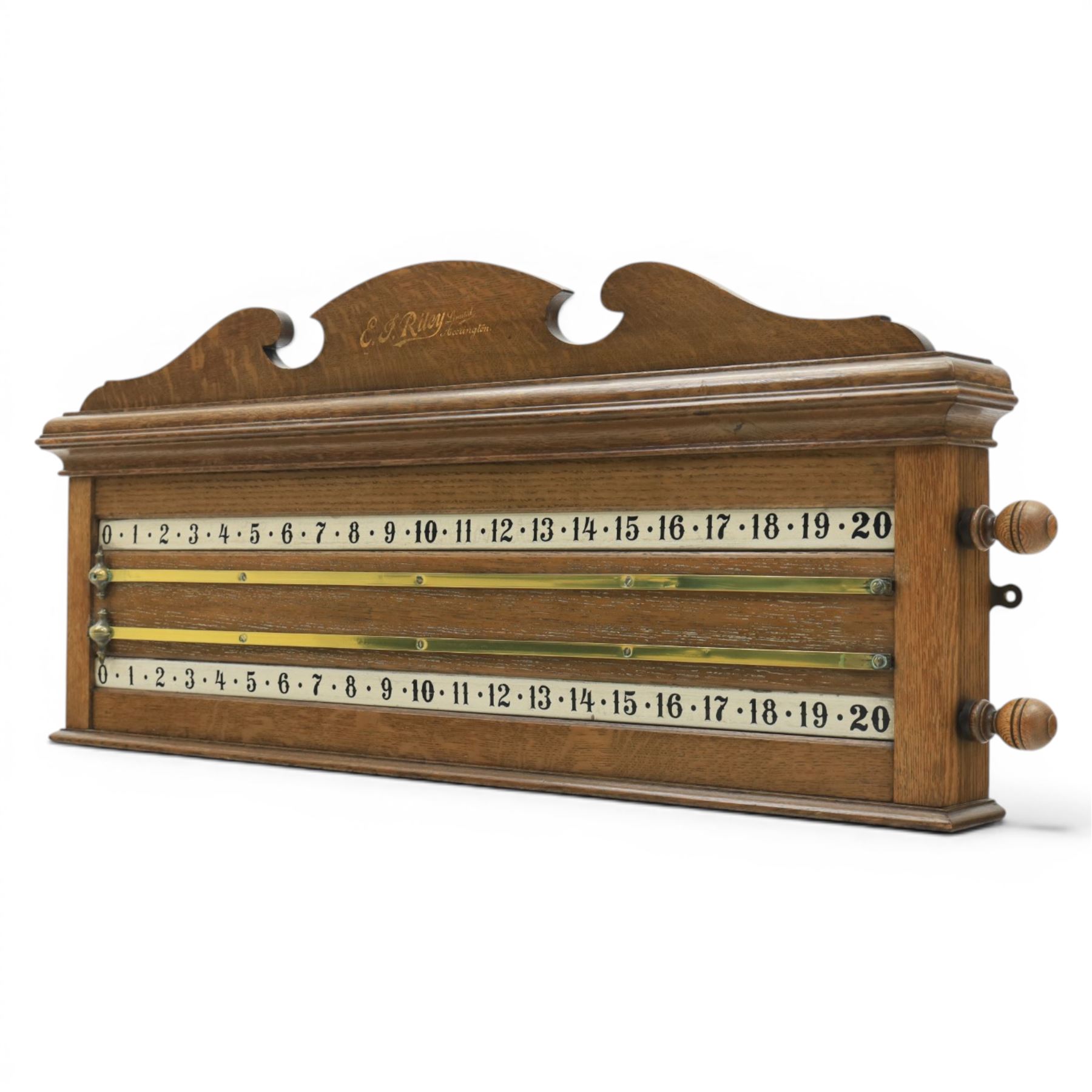 E.J. Riley - 20th century oak billiards scorer, with broken arch pediment with gilt markers mark, with revoling scorer with turned knob, brass indicator, with brass wall hangers