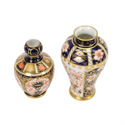 Four Royal  Crown Derby vases in imari patterns, including baluster vase with fluted rim in pattern no 6299, twin handled vase on a square base etc 