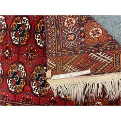 Two small Persian red ground rugs (122cm x 80cm and 111cm x 86cm)