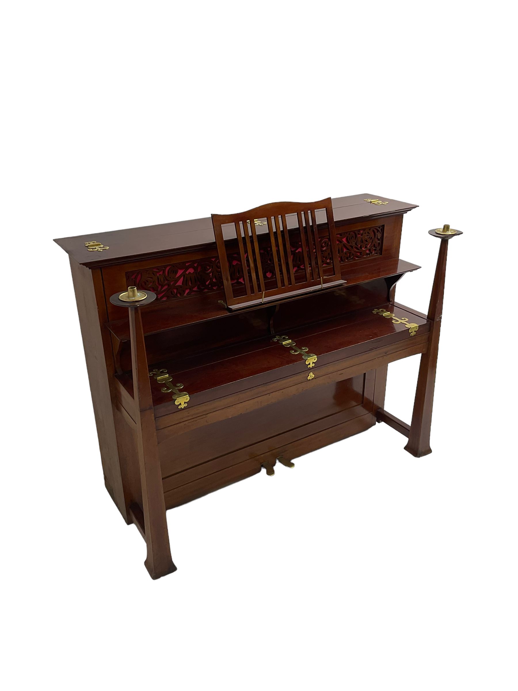 Carl Bechstein - late 19th century German overstrung upright piano, in a model 4 Arts and Crafts case designed by Walter Cave, with a lattice music desk and fretted silk backed front panel, brass hinged case lid and key fall with square tapered candle holders and circular sconces, iron frame, serial number 52187 (1899-1900), with an under damper action, 85 ebony and ivory keys, sustain and una corda pedals, original action, stringing, dampers, and action return straps, registered case number 328639, USA patent 24805.

This item has been registered for sale under Section 10 of the APHA Ivory Act