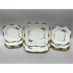 Art deco Shelley tea service for eight, decorated with floral sprigs, comprising teacup and saucers, dessert plates, two cake plates, milk jug and open sucrier, with to extra dessert plates