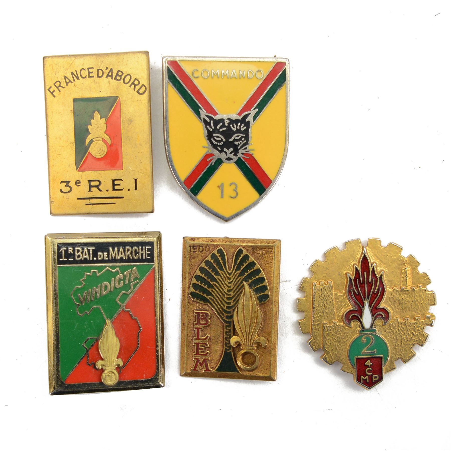 Five French Foreign Legion Kepi Blanc insignia, all marked Drago Paris to the reverse