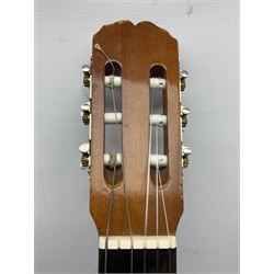 Spanish BM acoustic guitar with mahogany back and sides and spruce top L101cm; in cello carrying case; Roland foot pedal and two Yamaha foot pedals; tin D# organ pipe; folding music stand etc