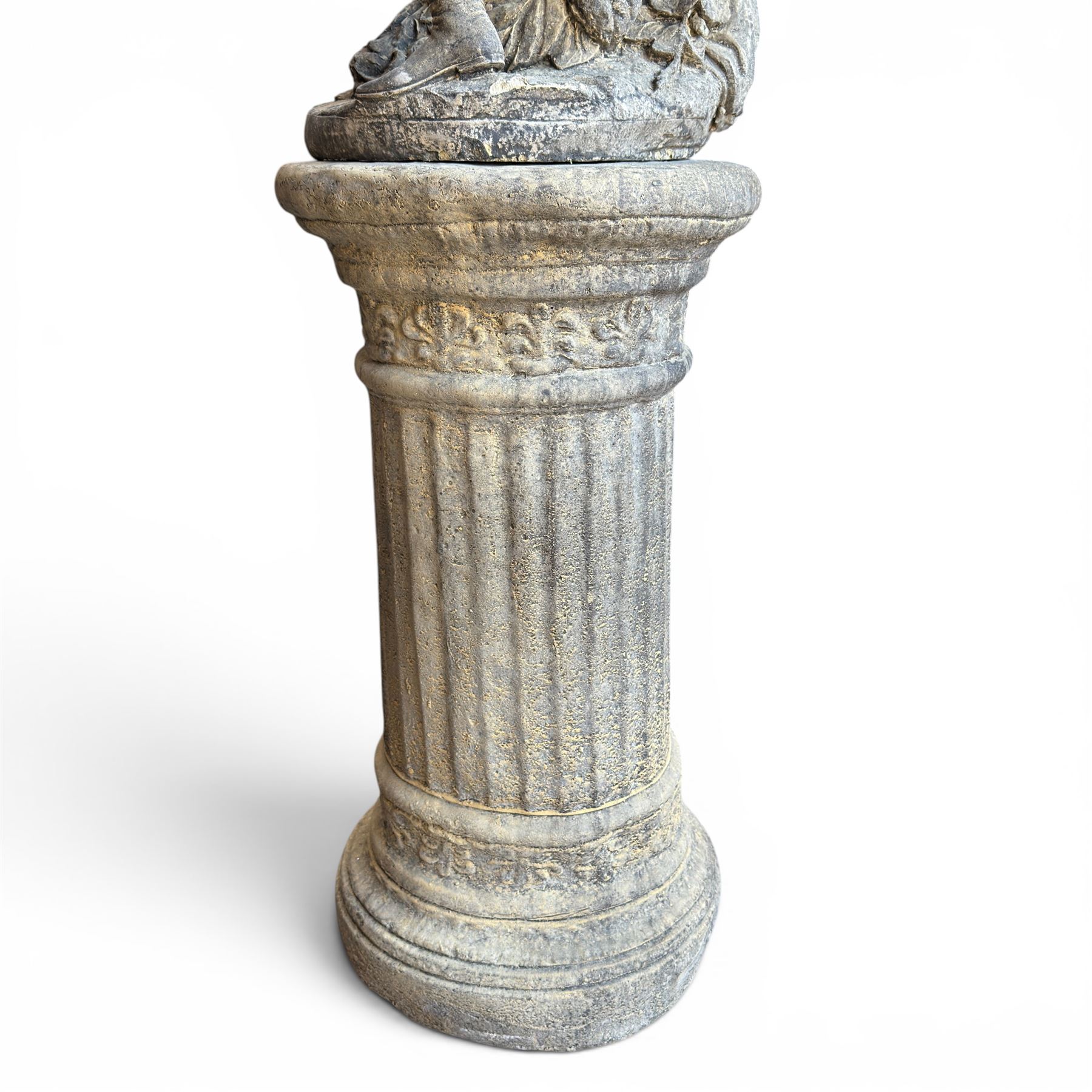 Composite garden statue group of Romeo and Juliet embracing, the couple adorned in Medieval dress standing on a naturalistic base with fallen flowers, raised on a Neoclassical fluted pedestal with Anthemion leaf motifs
