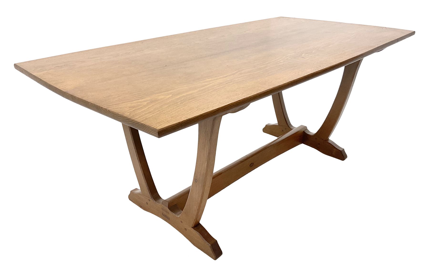 'Acornman' oak rectangular dining table, slightly curved rectangular top supported by two curved uprights, on shaped sledge feet connected by stretcher, by Alan Grainger of Brandsby, York