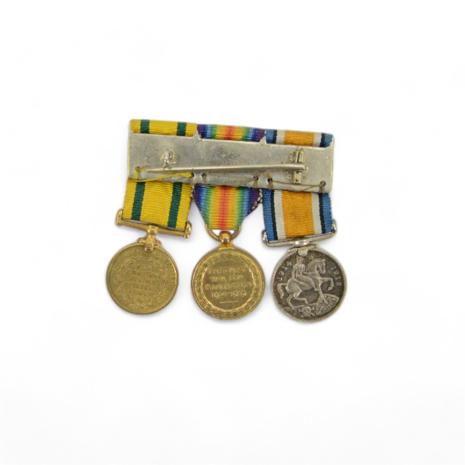 WWI trio of medals, comprising Territorial Force War Medal 1914-19, Victory Medal and British War medal, together with related with miniature group and a miniature of George V Territorial Decoration, awarded to 'Capt H.J. Fontaine' 