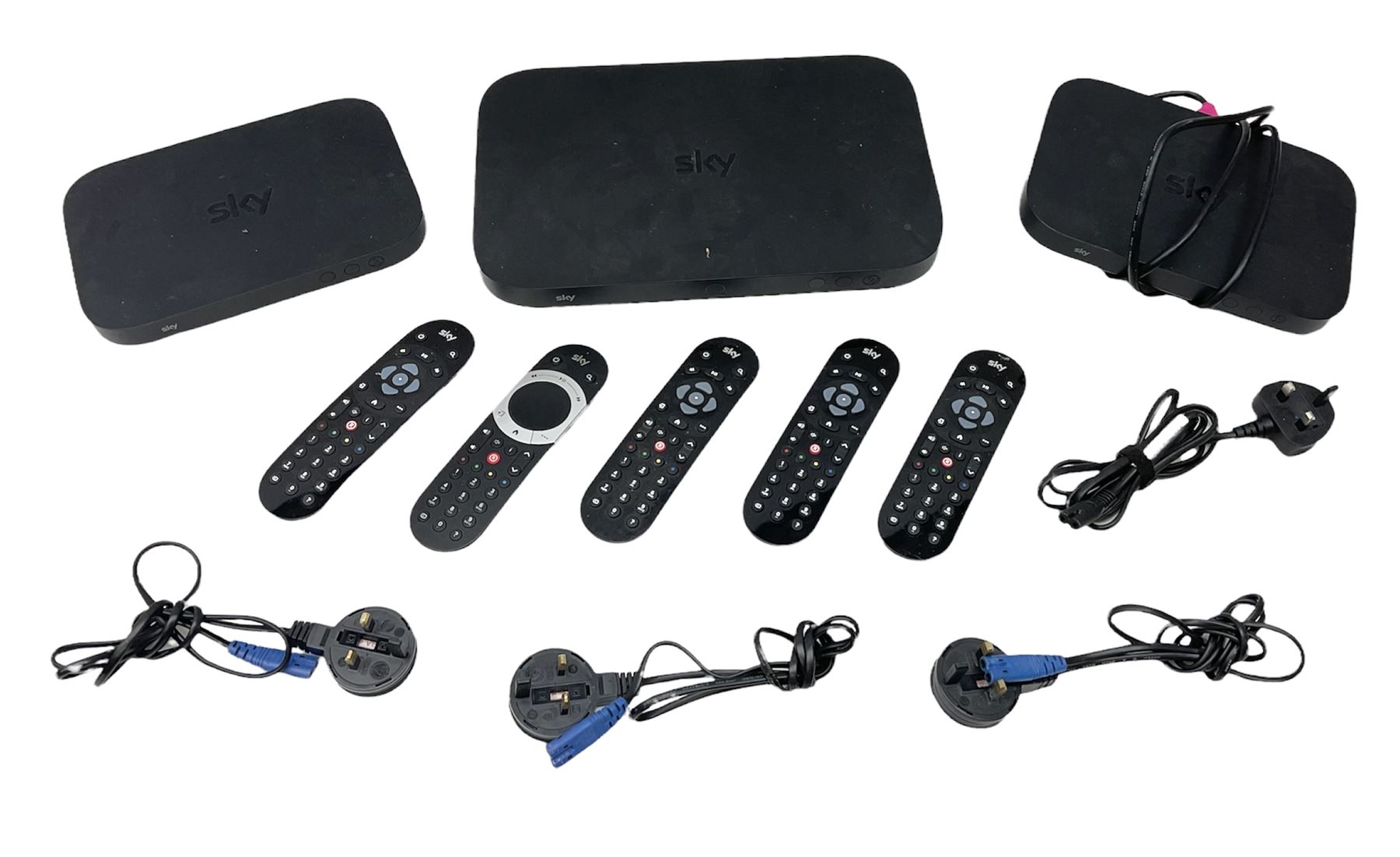 Sky Q box together with two mini room boxes with remotes and a quantity of remote controls and cables