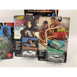 Corgi - The Definitive Bond Collection and The Director's Cut - nine die-cast vehicles from You Only Live Twice, Goldfinger, For Your Eyes Only, Diamonds Are Forever etc; Corgi Classics Moonraker Shuttle and Lotus Esprit; two other Corgi James Bond packs; Carrera Die Another Day Aston Martin V12 Vanquish; nine Johnny Lightning carded James Bond vehicles; Dragon carded Wai Lin figure; and three Fabbri tanks; all boxed/packaged (27)