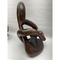 Helen Skelton (British 1933 – 2023): Two carved wooden abstract sculptures, one modelled as a entwined knot, largest H48cm. Born into an RAF family in 1933 in Kent and travelled the world extensively during her childhood. After settling in Bridlington, Helen immersed herself in painting, textiles, and wood sculpture, often inspired by nature's beauty. Her talent was showcased in a one-woman show at Sewerby Hall and recognised with the sculpture prize at Ferens Art Gallery in 2000. Sadly, Helen’s daughter passed away from cancer in 2005. This loss inspired Helen to donate her sculptures to Marie Curie upon her passing in 2023.
