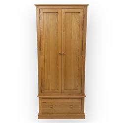 Cotswold & Co - contemporary light oak double wardrobe, plain rectangular form with twin panelled doors enclosing hanging interior, single full-width drawer below fitted with wooden knobs, on moulded plinth base