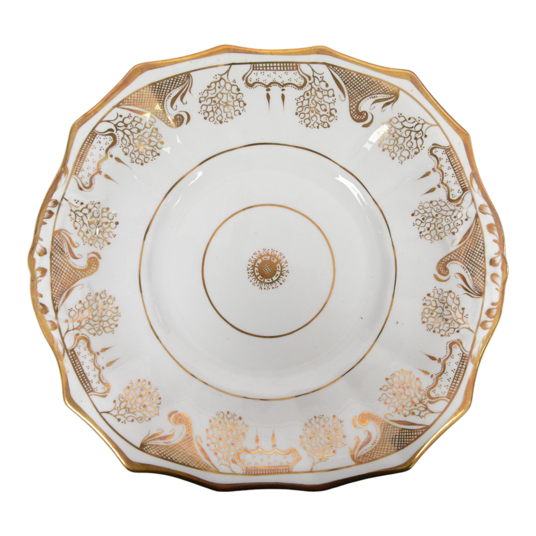 Late 19th century tea service, decorated in gilt with bands of seaweed type tendrils, thistles and cross hatch reserves upon a white glazed ground, comprising tea pot, twin handle lidded sucrier, milk jug, slop bowl, three serving plates, twelve cups and saucers and eleven side plates