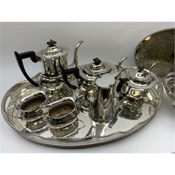 A group of silver plate, to include a large oval tray with pierced gallery, L62cm, smaller oval tray, shaped and pierced swing handled basket, fluted bowl upon stepped foot, and teawares to include teapot, coffee pot, twin handled sucrier and cream jug all marked Viners, etc. 