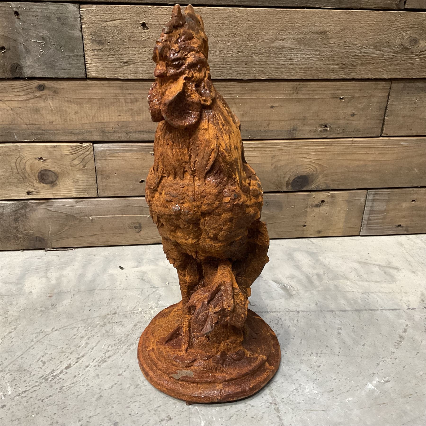 Small cast iron cockerell, on circular base