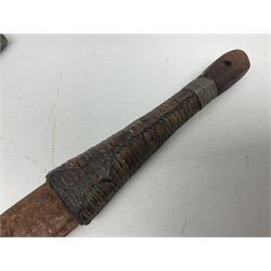 Omani presentation sword kattara, with 77cm  broad slightly curved single edge blade with two fullers, leather bound hilt woven with silver wire decoration and iron pommel;  in tooled leather scabbard with chased silver mounts and presentation plaque 'To Capt. D.M. Naylor From C Company NFR Oman Dec 1962' (Northern Frontier Regiment) L99cm overall