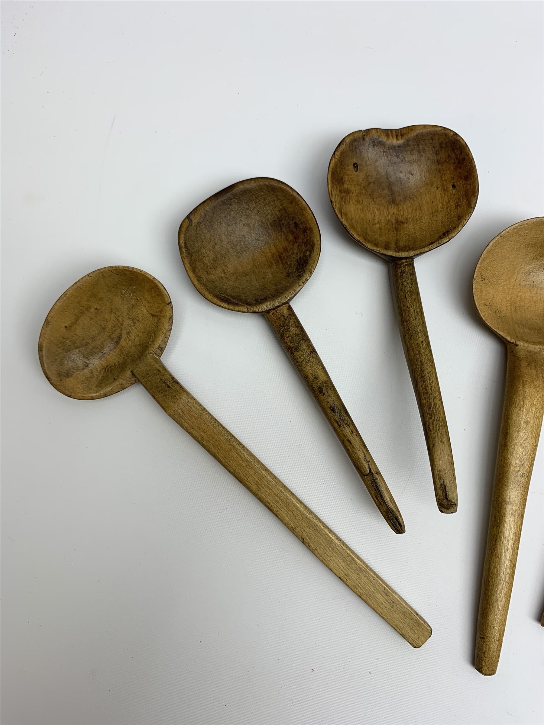 Group of beech and sycamore Welsh Cowl and other spoons, largest example L21.5cm