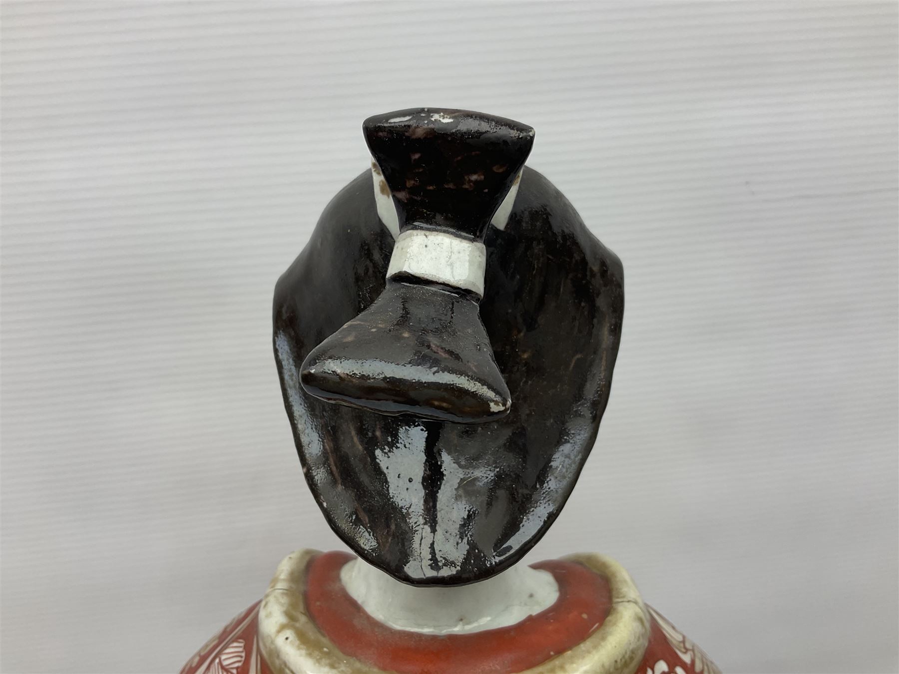 Large Japanese Imari porcelain figure, modelled as a Bijin, wearing a long kimono decorated with apple blossom and leafy branches on a white ground, with gilt detailing, possibly Edo period, H63cm