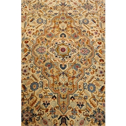  Persian Kashan pale yellow ground rug, central geometric medallion, 410cm x 270cm  