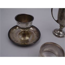 Group of silver, comprising twin handled trophy cup, christening mug, egg cup and two napkin rings, all hallmarked
