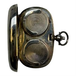 Early 20th century silver sovereign holder, of plain oval form, the hinged cover, opening to reveal two spring loaded recesses for half and full sovereigns, hallmarked Birmingham 1911, W5cm