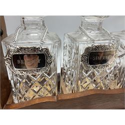 Edwardian silver plate mounted oak tantalus, containing three square sided cut glass decanters, complete with key, H33cm