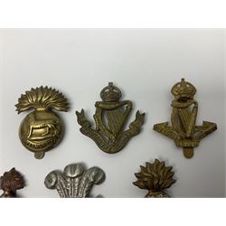 Fourteen cap badges of Irish interest including Royal Dublin Fusiliers inscribed to the slider 'From A. O'Connor 2nd Batt. Dec.2nd 1915', Connaught Rangers, South irish Horse Yeomanry, Inniskilling Fusiliers, Royal Irish Regiment etc; and seven Welsh badges including South Wales Borderers, Welsh Guards, 3rd Bn. Monmouthshire Regt. etc (21)