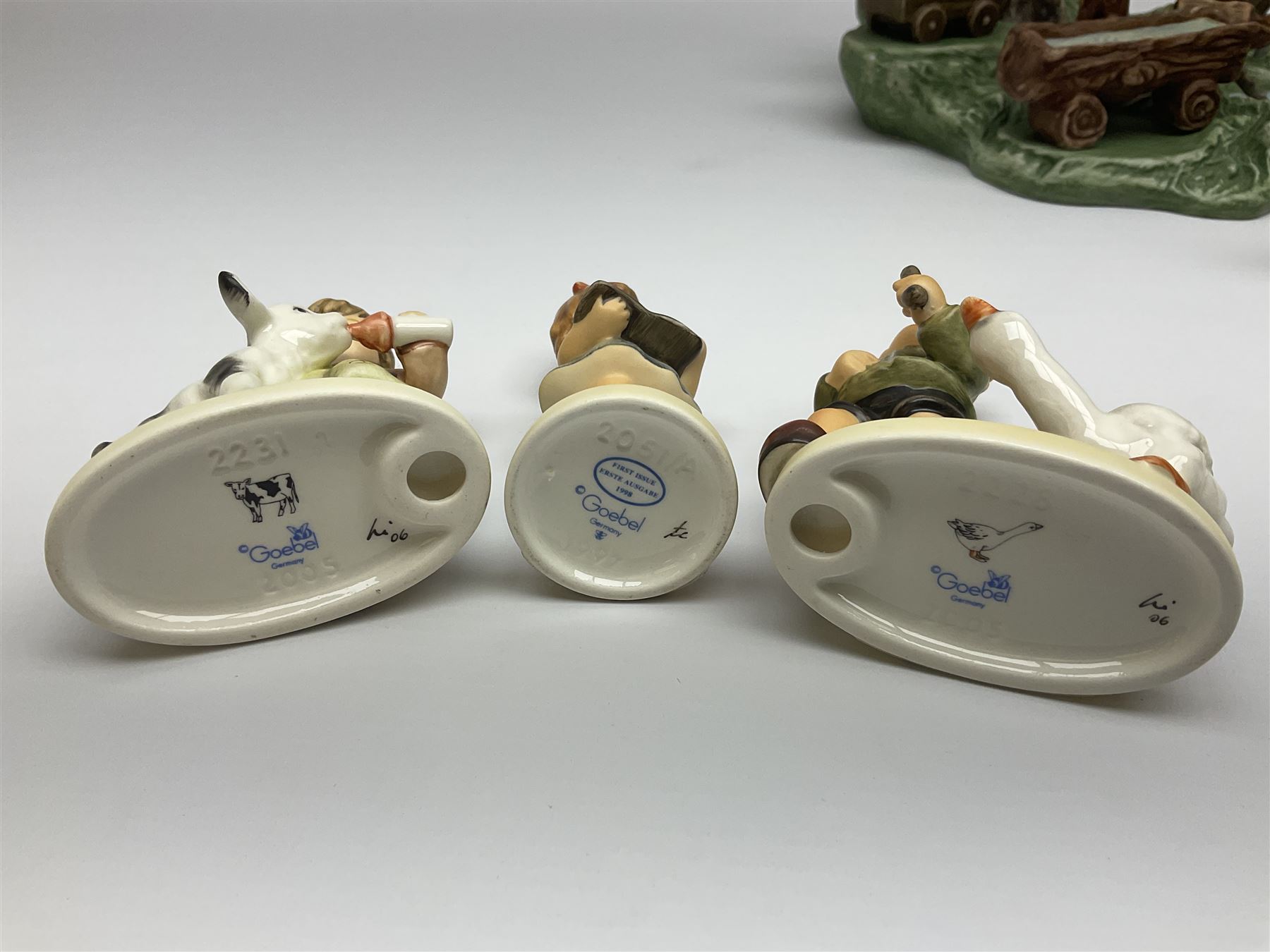 Collection Hummel figures by Goebel, together with three hummel landscapes, Hummel Quelle, Hummel Weiher and Hummel Garten