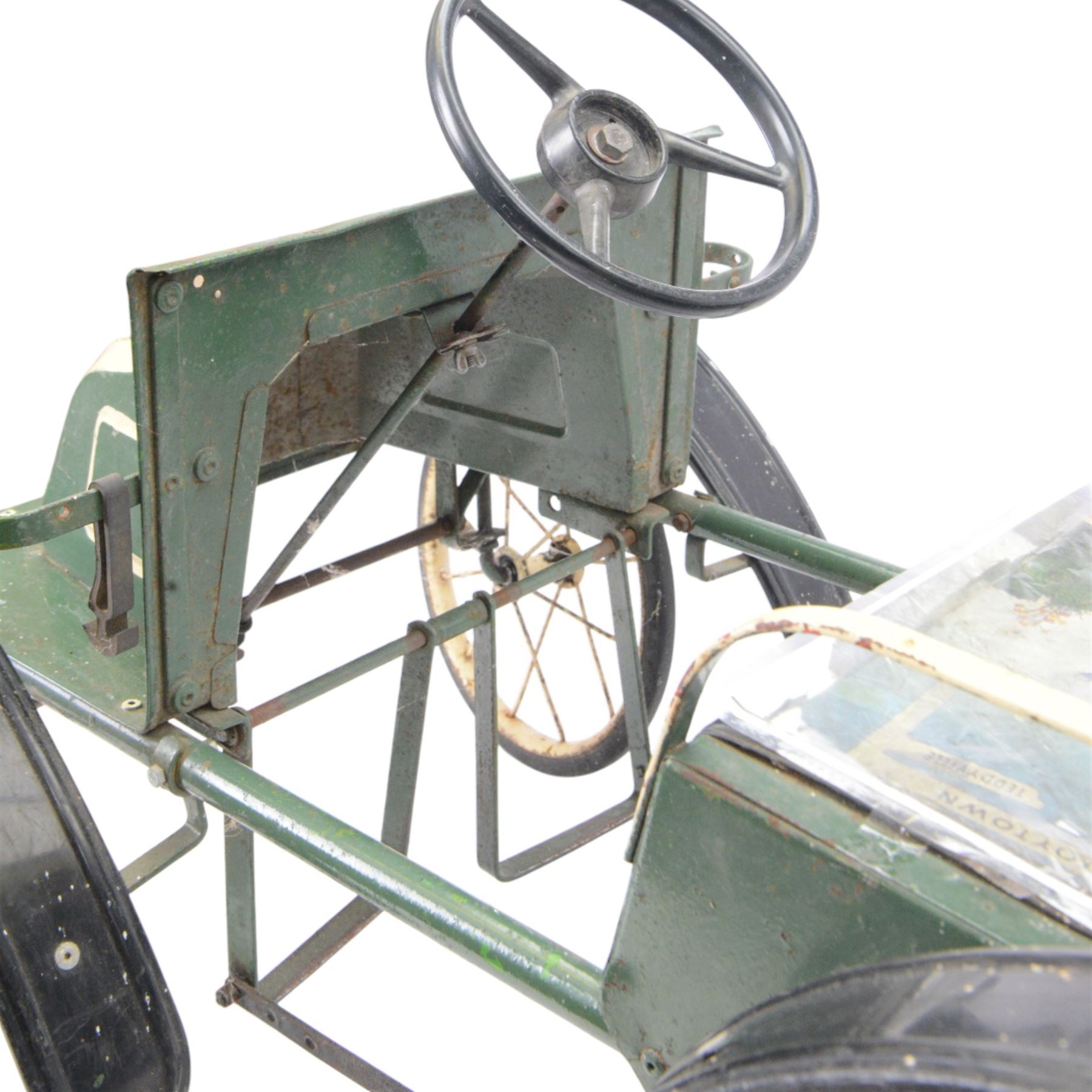 Triang child's pedal car in the style of a vintage automotive, likely a De Dion Bouton or an early Renault, painted in dark green with pale yellow details, H52cm