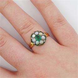 19th century 14ct gold emerald, opal and old cut diamond cluster ring, the principal oval cut emerald, with opal, diamond and emerald surround
