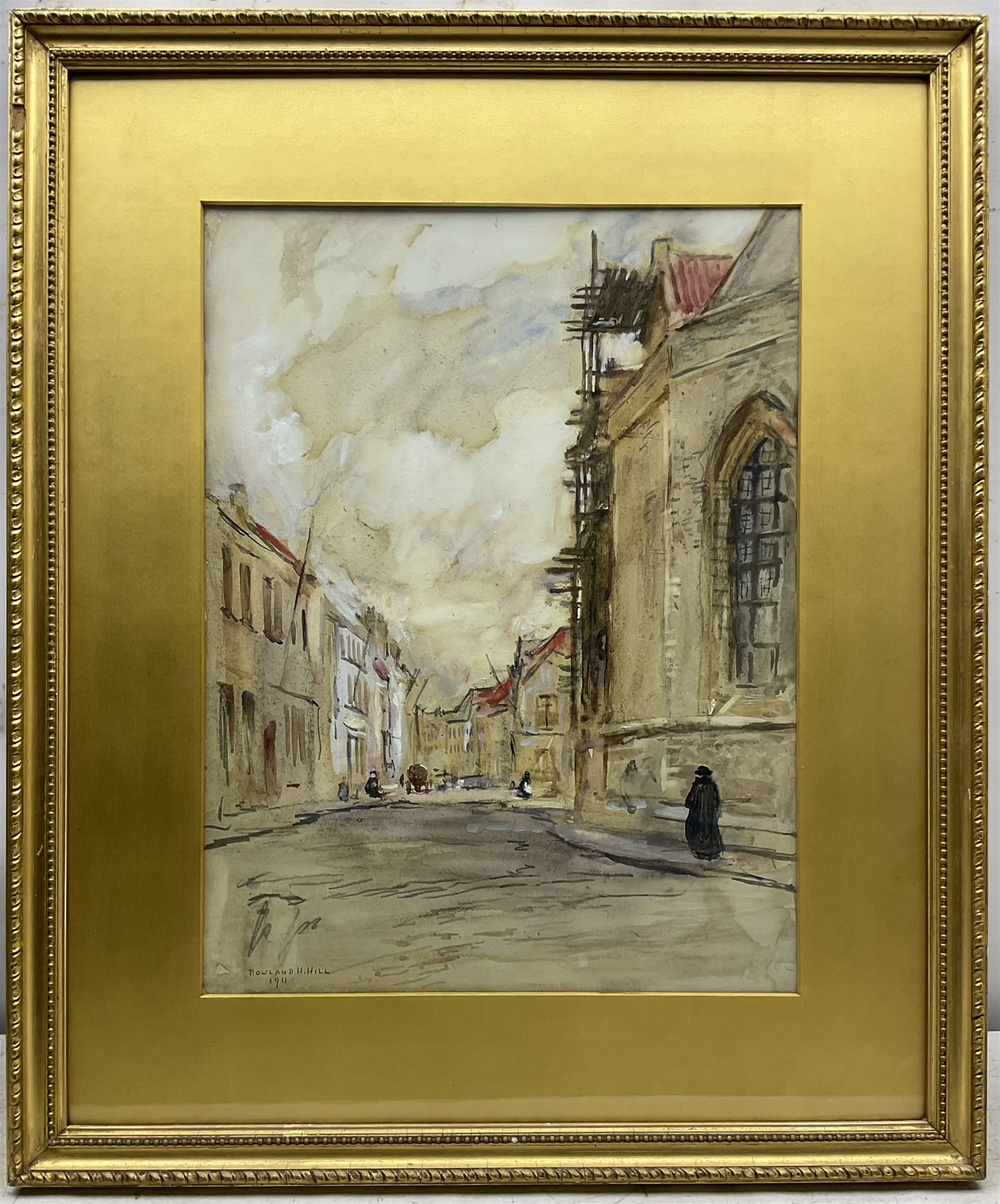 Rowland Henry Hill (Staithes Group 1873-1952): 'A Street Scene - Bruges', watercolour heightened in white signed and dated 1911, original title label verso 47cm x 35cm