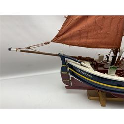 Wooden model of the Peterhead Herring Fishing Boat, Love Divine, PD404. on stand together with Wick Herring Fishing Boat, Galilee WK.1. on stand, L105cm, H64cm