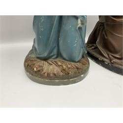 Two religious painted plaster figures of Mary and Joseph kneeling on oval plinths, with impressed mark 'Raffl et Cie Paris', H60cm 