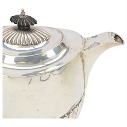 Early 20th century four piece silver tea service, comprising teapot, hot water pot, open sucrier and milk jug, all of oval part fluted form, the teapot and hot water pot with Bakelite type handles and finials, hallmarked James Deakin & Sons (John & William F Deakin), Sheffield 1918