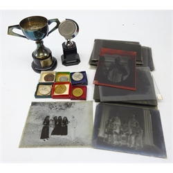  Six boxed 1950s RAF sporting medals for rugby and athletics, including two bomber command, two winners trophies for Dhekelia Garrison and Cyprus, along with twenty five 1/2 plate glass negatives, mostly WWl Military portraits incl. SS Waverley etc  