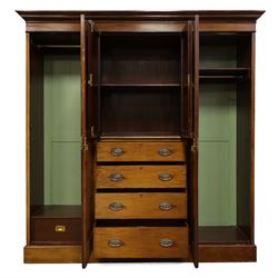19th century mahogany triple wardrobe, moulded cornice above a central cupboard door enclosing shelves interior, flanked by full height panelled doors with clothes rails in each, the centre fitted with four graduated drawers with oval brass handles, on a moulded plinth base