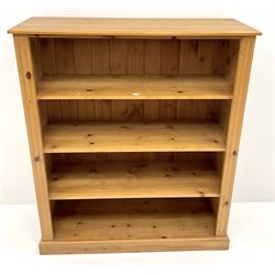 Pine bookcase, three shelves, platform base