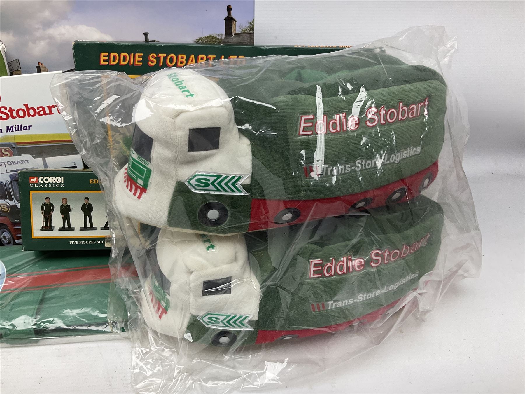 Eddie Stobart - accessories, memorabilia and promotional merchandise including Corgi Self Assembly Model Transport Depot and Five Figures Set; scarf; slippers; mugs and beakers; coasters; note book; books etc