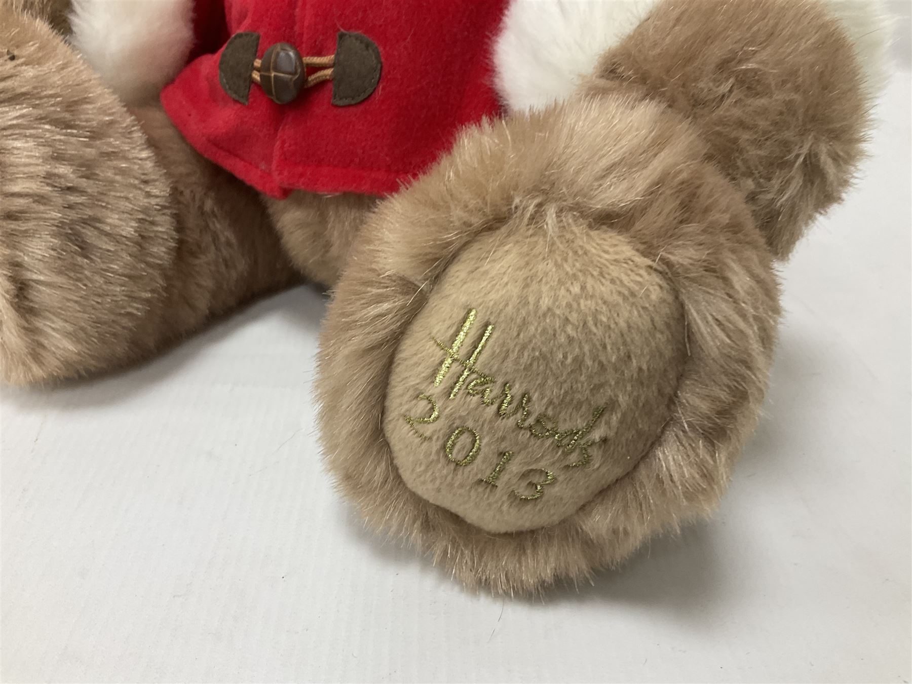 Six Harrods annual teddy bears, dating between 2011 and 2016, tallest H38cm