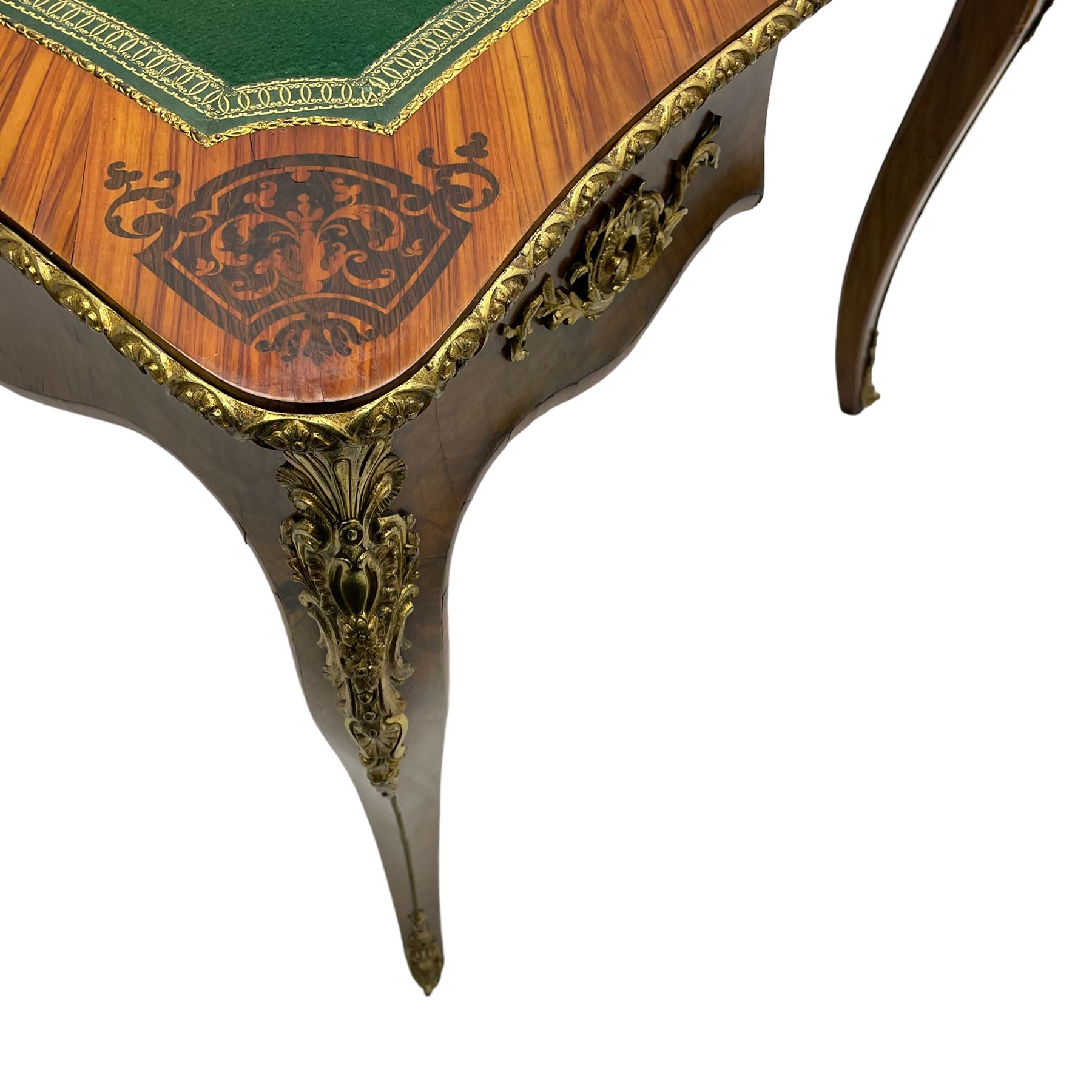 20th century French walnut and Kingwood card table, shaped fold-over top with figured quarter-matched veneers and floral egg and dart moulded edge in gilt metal, shaped aprons decorated with shell motifs with extending foliage, pull-out action base revealing storage well, on cabriole supports with ornate gilt metal mounts 