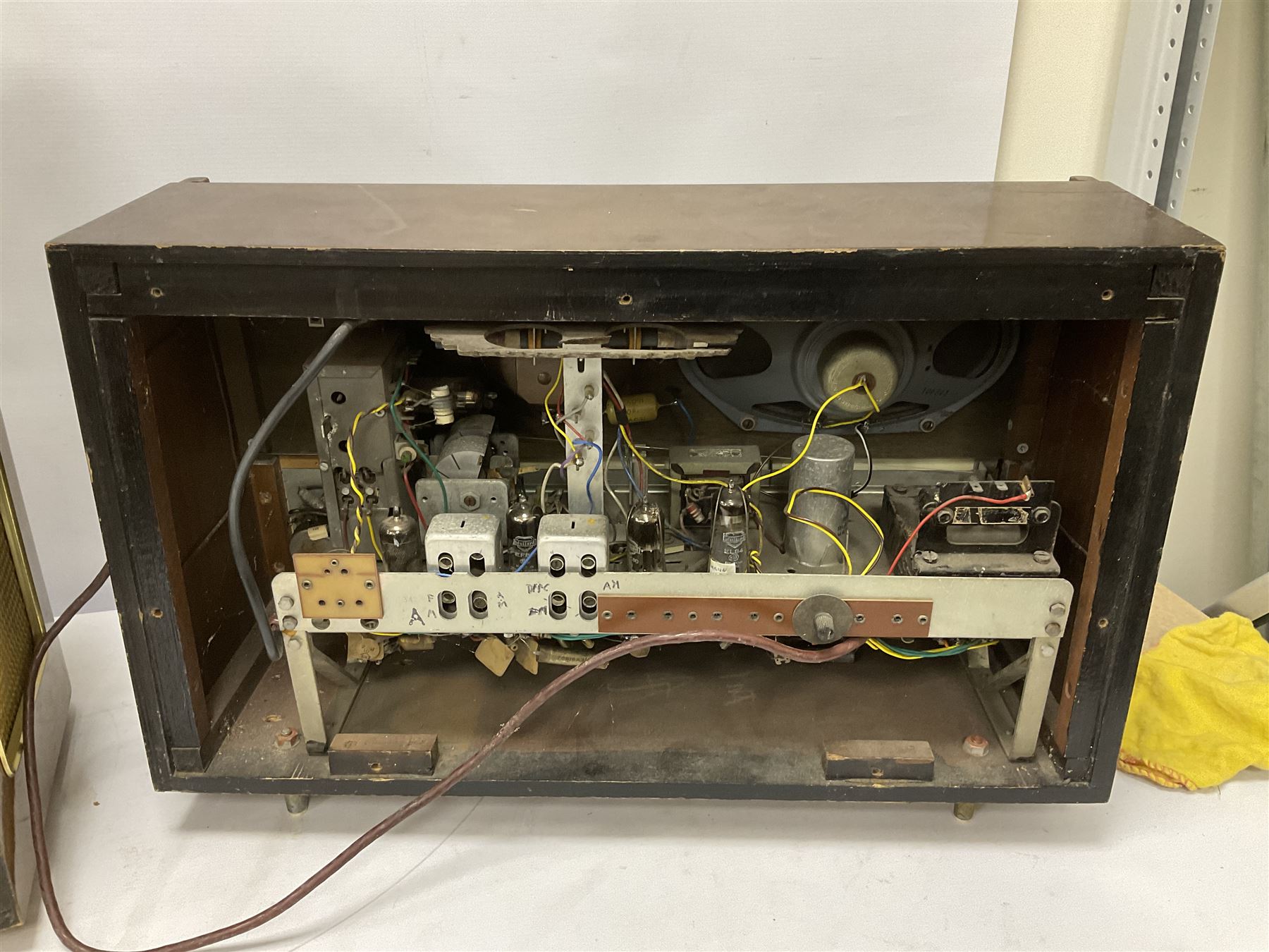 Three mid 20th century radios comprising 1950s Grundig wood cased valve radio model 3028/GB, together with a 1970s Grundig Type RF 153 CS 150 radio in teak case, and an Ekco 355 1960's valve radio, largest W60 H35cm D23cm