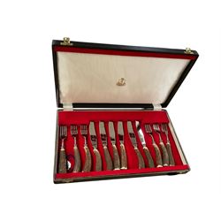 Horn handled canteen of cutlery set, together with with wooden cigarette box, two Nao figures and Lladro figure 