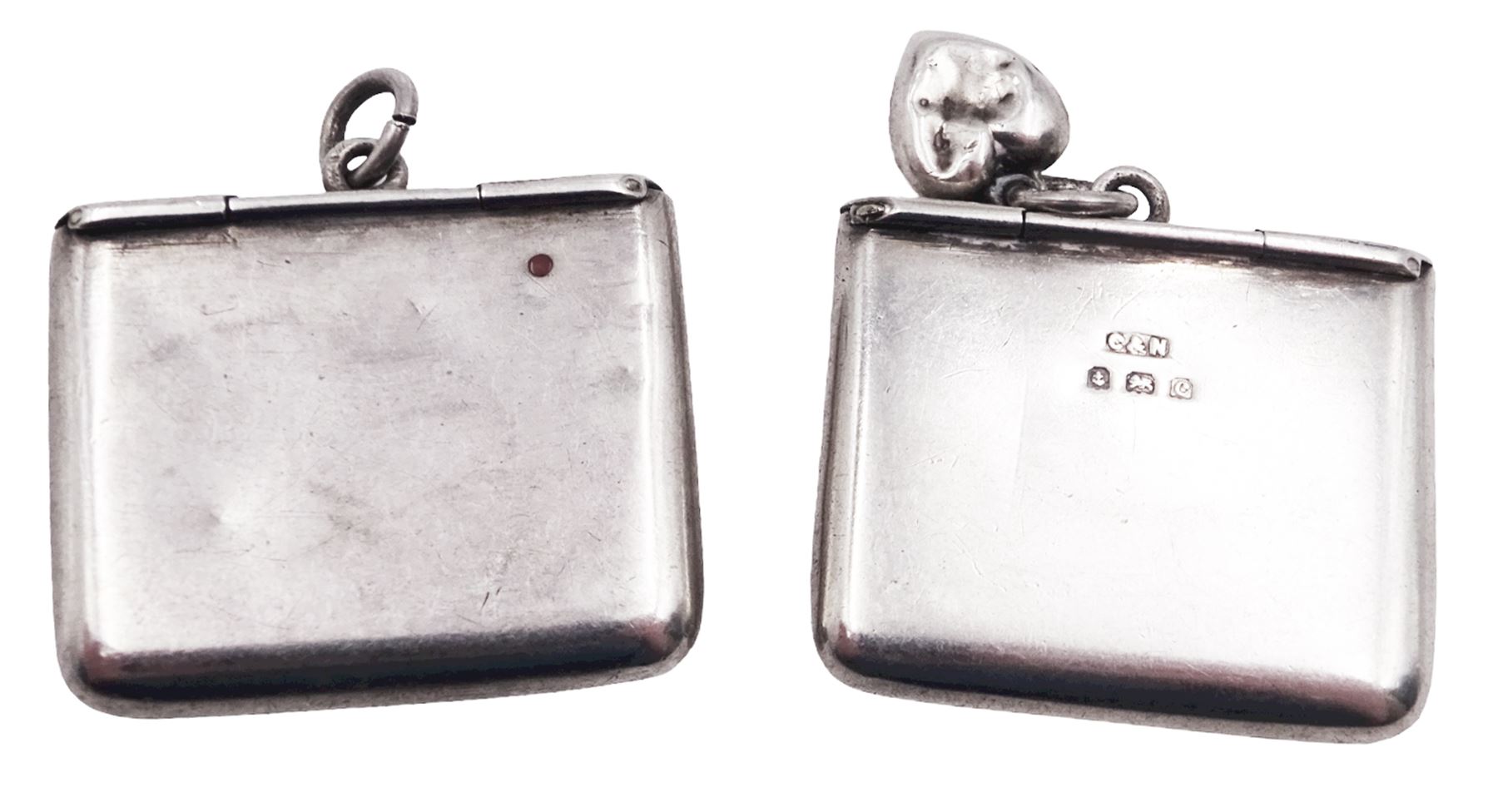Two Edwardian silver stamp holders modelled in the form of envelopes, the first example detailed 'Stamps', hallmarked Crisford & Norris Ltd, Birmingham 1903, the second of plain form, hallmarked Crisford & Norris Ltd, Birmingham 1902, approximate total weight 0.38 ozt (11.8 grams)