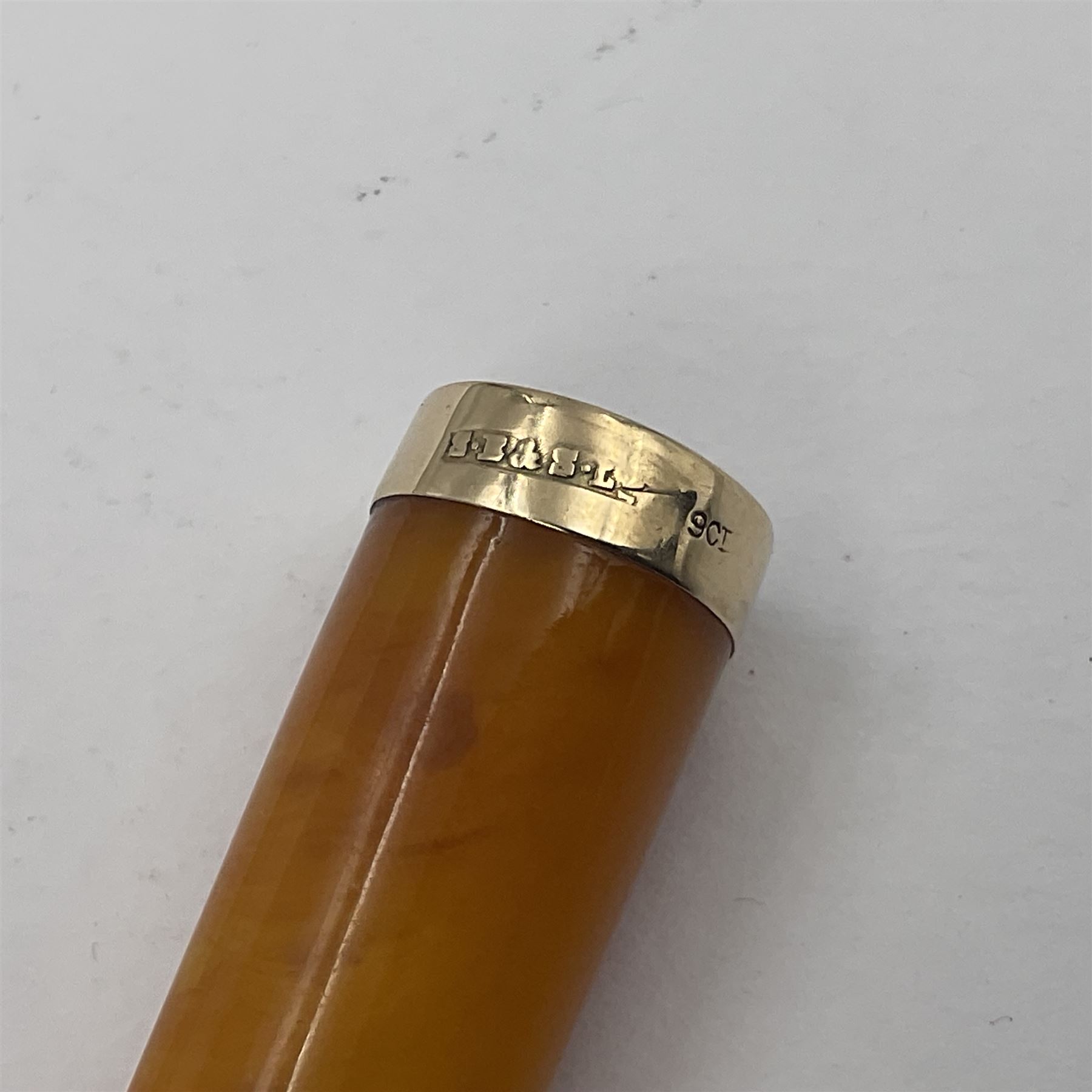 Two cheroot holders, one example with 9ct gold collar, together with two Victorian silver cheroot holder cases, both of typical form, one with personal engraving to cover, hallmarked Sampson Mordan & Co, London 1896