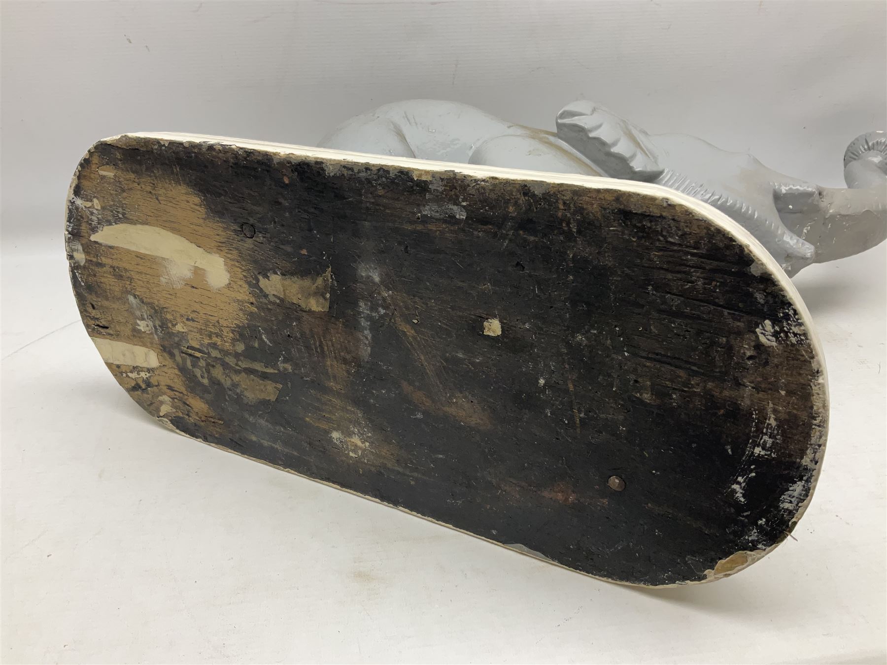 Composite figure of an elephant, painted grey, upon white base, L45cm H65cm