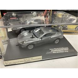 Corgi - The Definitive Bond Collection and The Director's Cut - nine die-cast vehicles from You Only Live Twice, Goldfinger, For Your Eyes Only, Diamonds Are Forever etc; Corgi Classics Moonraker Shuttle and Lotus Esprit; two other Corgi James Bond packs; Carrera Die Another Day Aston Martin V12 Vanquish; nine Johnny Lightning carded James Bond vehicles; Dragon carded Wai Lin figure; and three Fabbri tanks; all boxed/packaged (27)