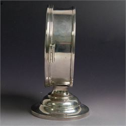 Late Victorian silver lunette, of plain circular form with hinged cover opening to reveal gilt interior, upon a circular domed foot, hallmarked Lambert & Co, London 1897, H13cm