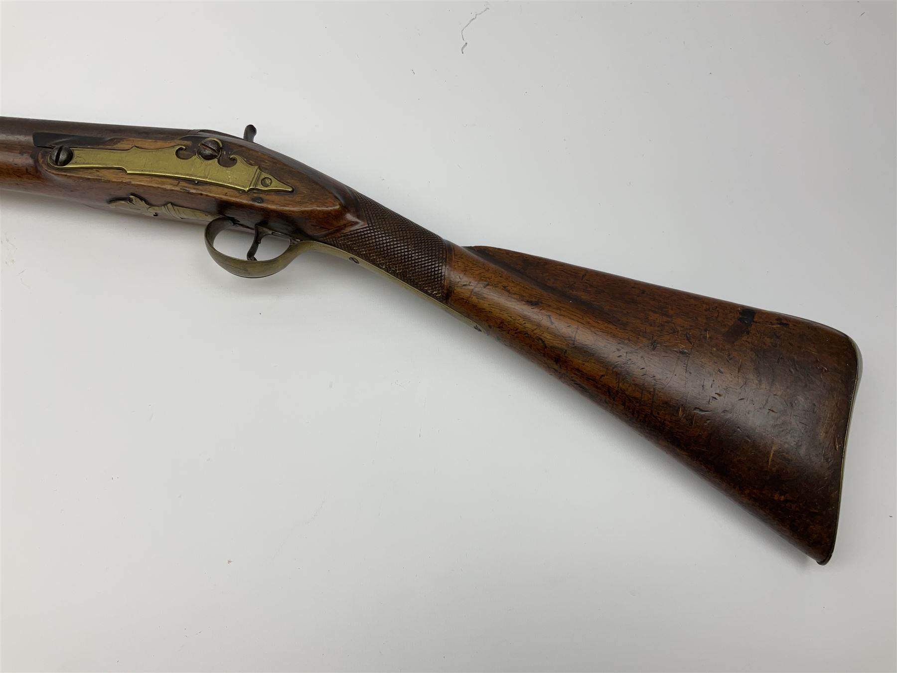 Early 19th century 15-bore flintlock converted to percussion cap fowling piece, the lock stamped T. Richards, walnut half stock with brass fittings including trigger guard with pineapple finial and 91cm barrel with ramrod under L129cm overall
