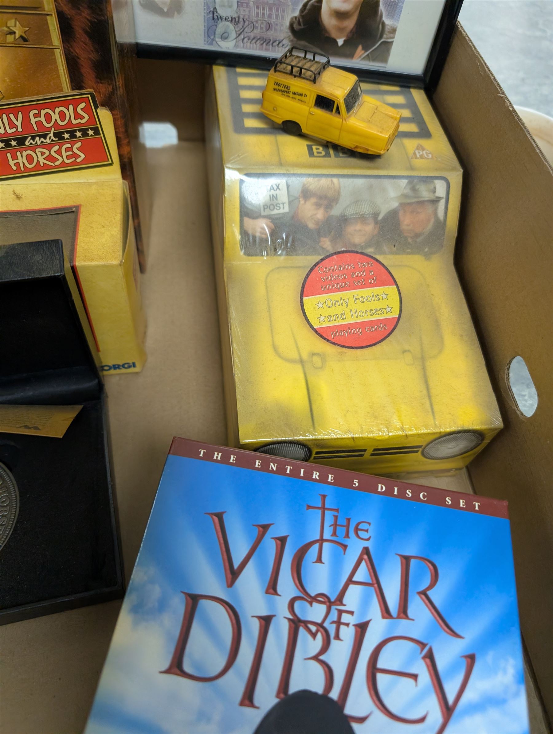 Collection of Only Fools and Horses memorabilia, including Westminster Mint limited edition fifty pence coin set, DVD box set, Corgi Reliant Regal, playing cards, framed bank notes, Griffin Cartoon of the bar scene, etc, together with a Vicar of Dibley DVD box set