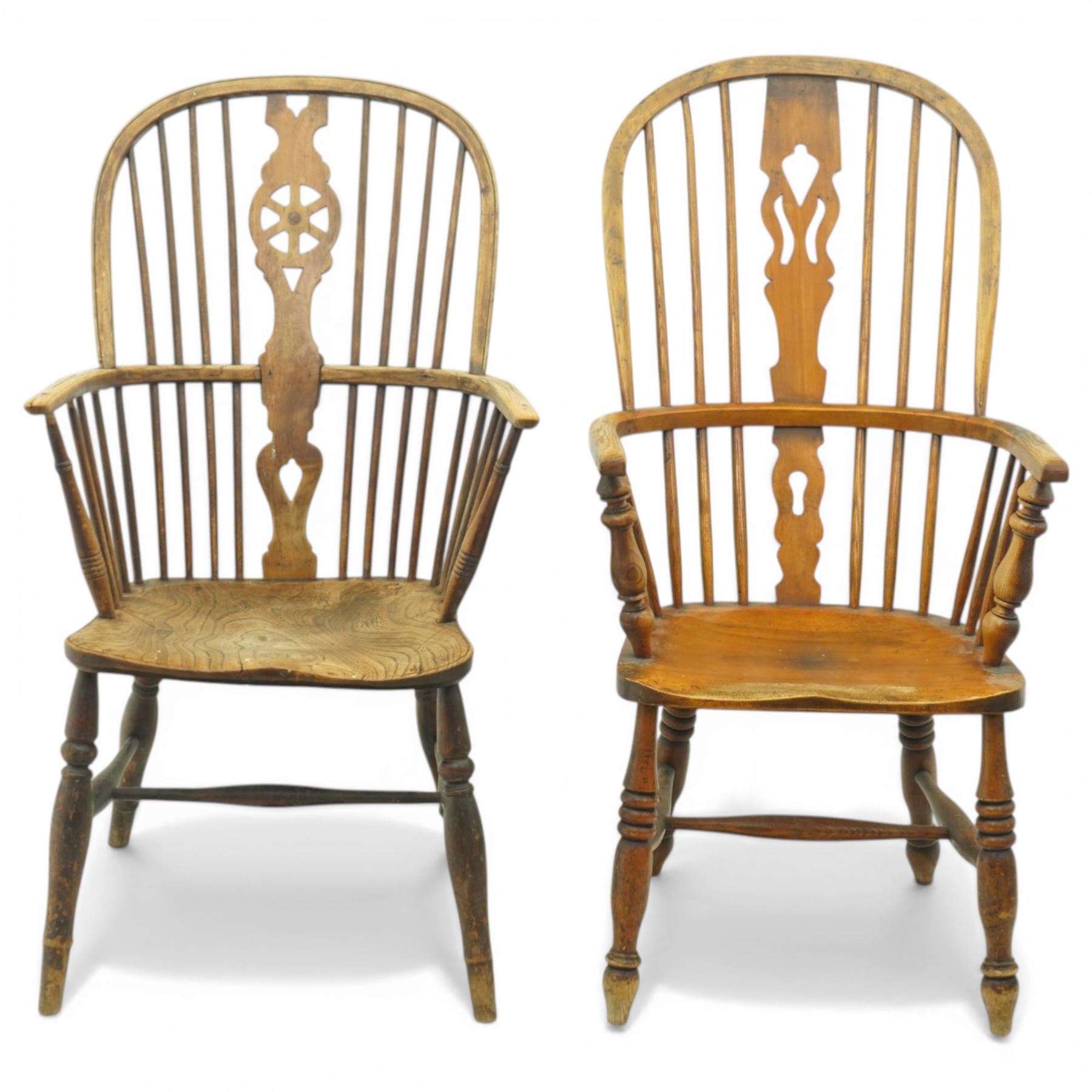 Set of two late 19th century elm and beech Windsor armchairs, each with hoop backs and turned spindles, shaped central splats, solid seats and turned supports united by H-stretchers